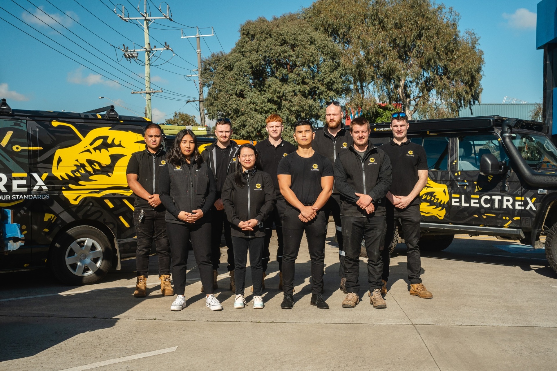 The Electrex Melbourne team in front of branded service vans
